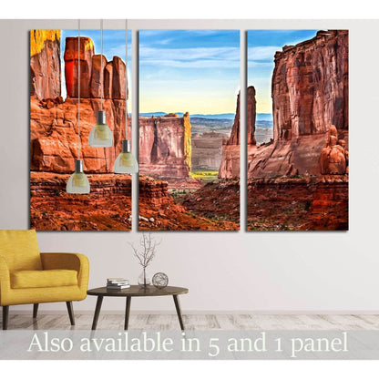 Majestic Sandstone Cliffs Wall Art for Rustic Interior ThemesThis canvas print beautifully captures the rugged grandeur of desert rock formations under a clear sky. The rich, warm hues of the rocks are striking against the expansive view, making it an exc