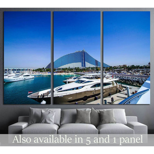 Dubai Jumeirah Beach Hotel canvas print with yachts in the marina, displayed above a sofa