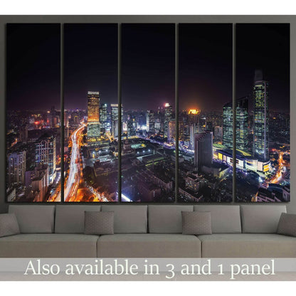 Shanghai skyline night canvas print with glowing city lights above a sofa in a modern living room