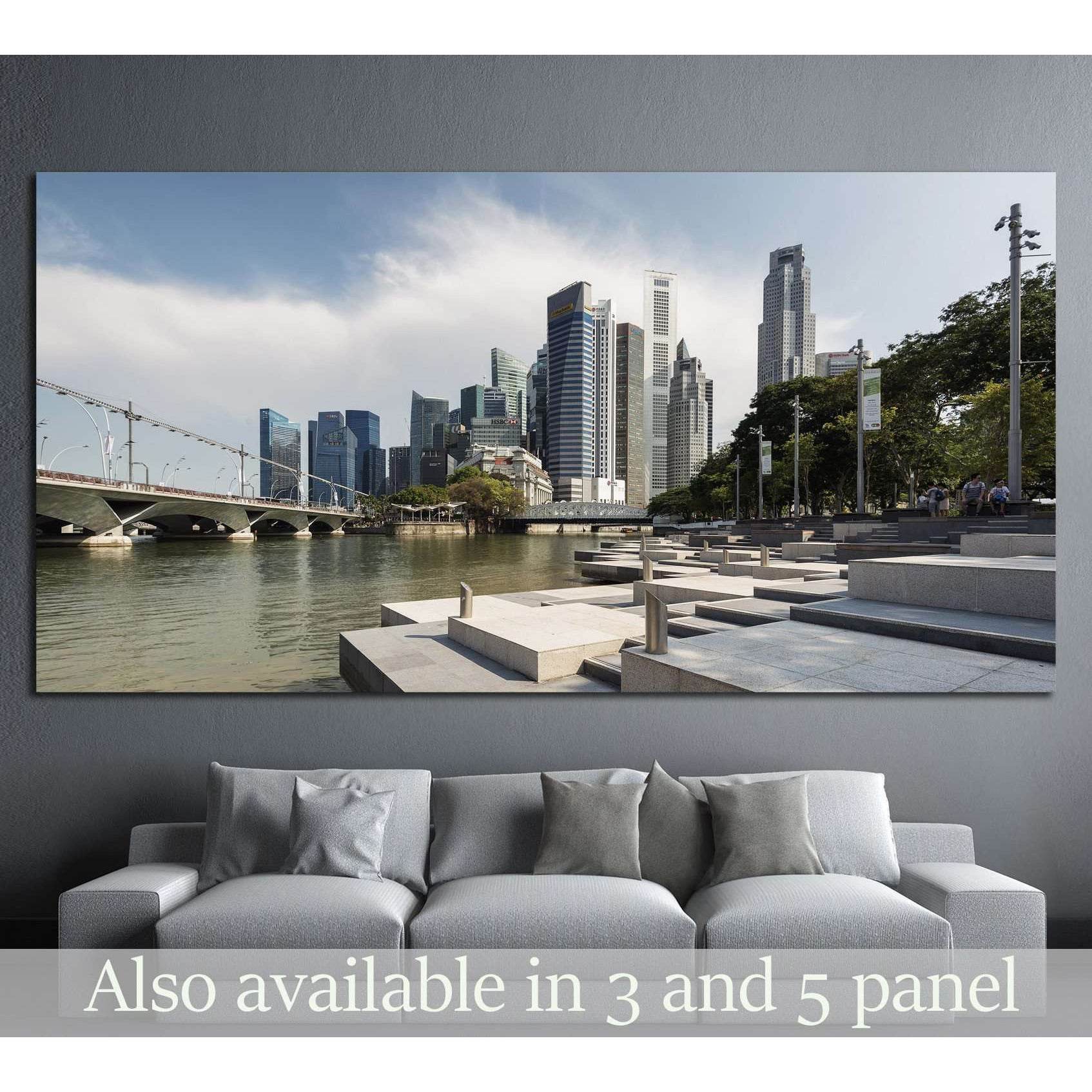 Singapore CBD skyline and riverfront promenade canvas print above sofa in a modern living room