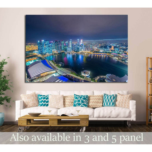 Singapore skyline canvas print above a sofa, showing Marina Bay at night with glowing city lights