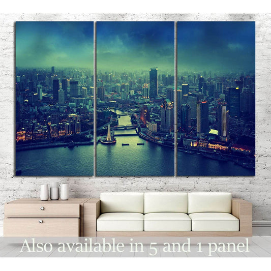 Shanghai skyline triptych canvas print above a sofa in a modern living room with moody teal dusk tones