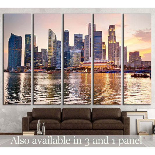 Singapore skyline sunset canvas print with waterfront reflections, displayed as multi-panel wall art above a sofa