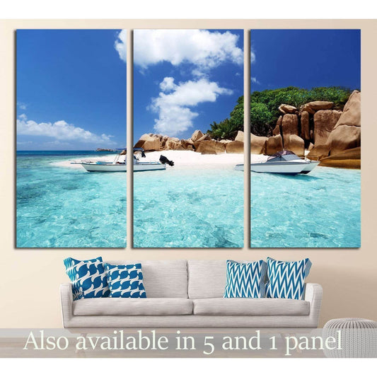 Seychelles beach triptych canvas print with white speed boats in turquoise water above a sofa