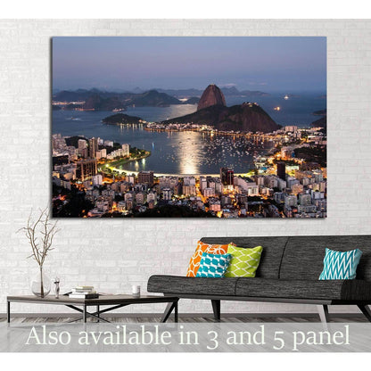 Sugarloaf Mountain canvas print with Rio de Janeiro harbor lights at dusk above a sofa