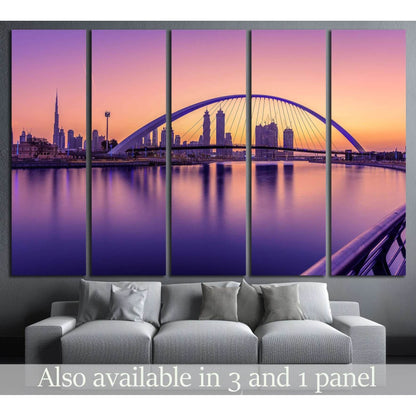 Dubai Canal sunrise canvas print with arched bridge and skyline in pink purple tones