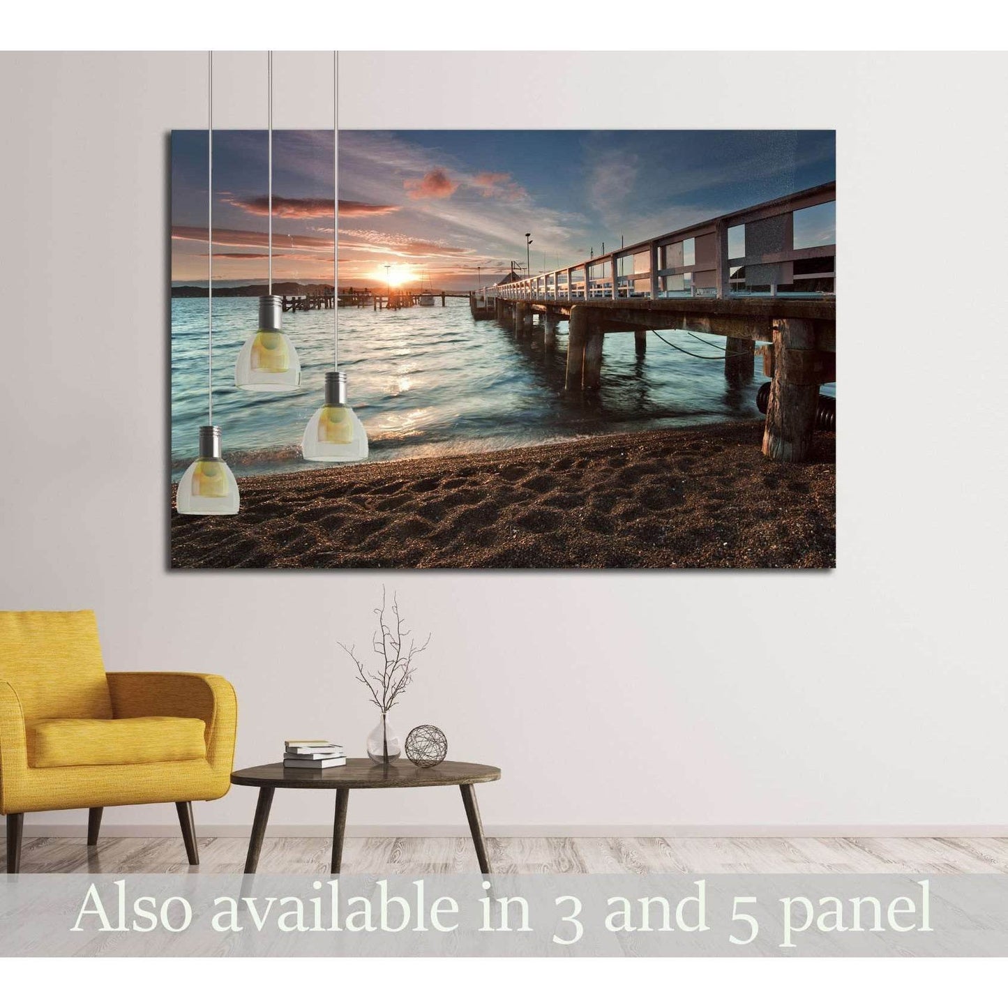 Russell pier sunset canvas print hung above a chair in a modern coastal living room