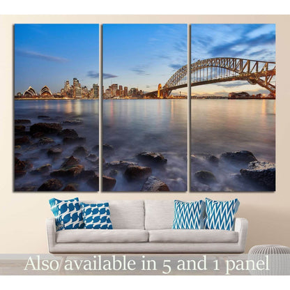 Sydney Harbour Bridge and Opera House triptych canvas print above sofa in a modern living room