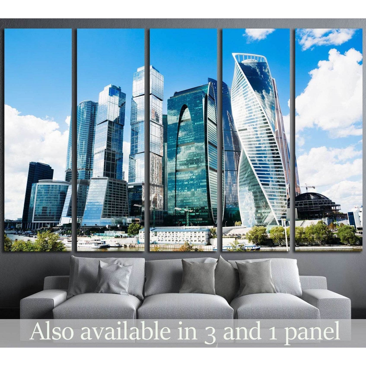 Moscow City skyline canvas print in five-panel mockup above sofa with blue skyscrapers and riverfront