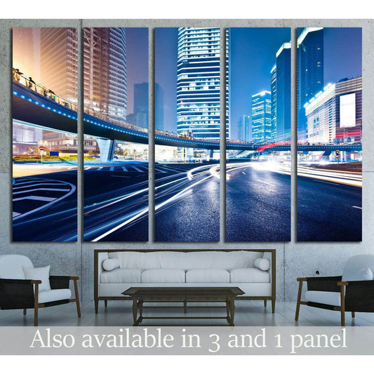 Shanghai skyline canvas print with blue light trails above a sofa in a modern living room