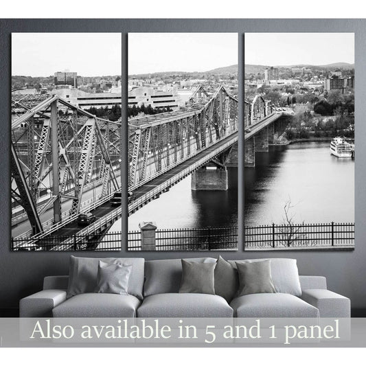Black and white Royal Alexandra Bridge Ottawa canvas print shown above a sofa in a modern living room