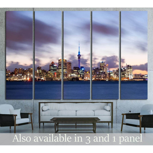 Auckland skyline canvas print with Sky Tower at twilight above sofa in a modern living room