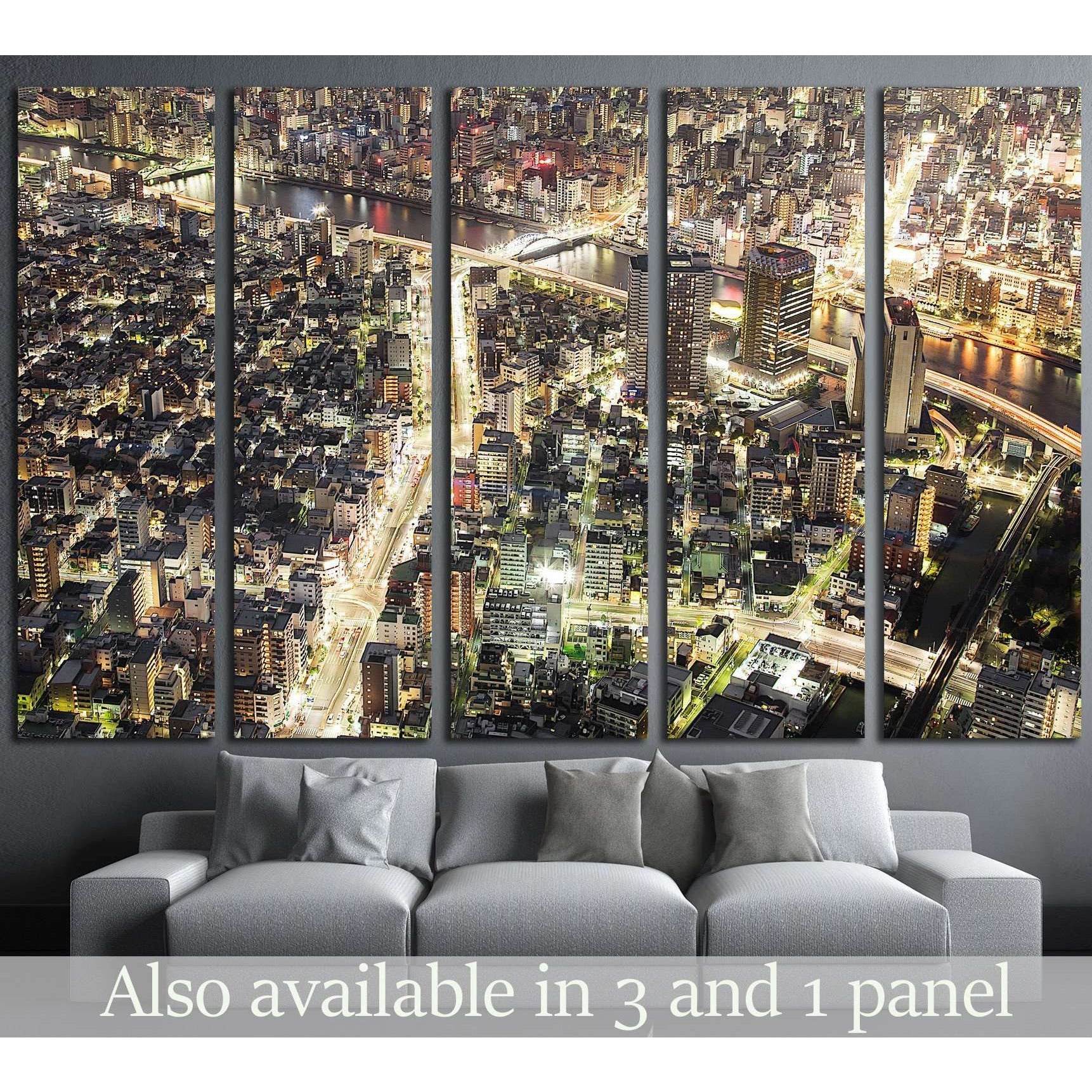 Tokyo night skyline canvas print in five panels above sofa in a modern living room