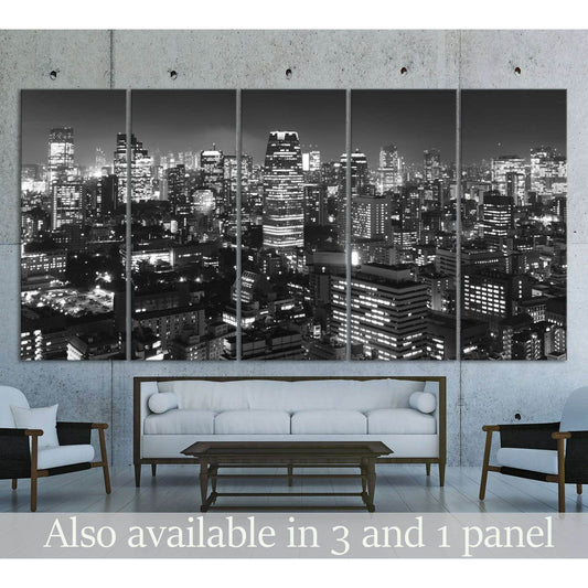 Black and white Tokyo skyline canvas print hung above a sofa in a modern living room
