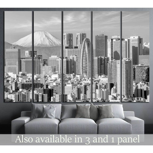 Black and white Tokyo skyline canvas print with Mount Fuji, shown as multi-panel wall art above a gray sofa