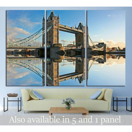 Tower Bridge sunset canvas print with Thames reflection displayed above sofa in a modern living room