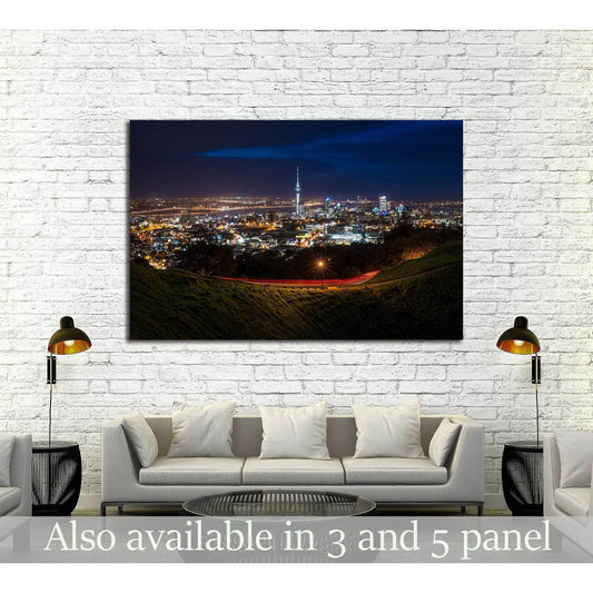 Auckland night skyline canvas print from Mt Eden with Sky Tower and city lights above a sofa