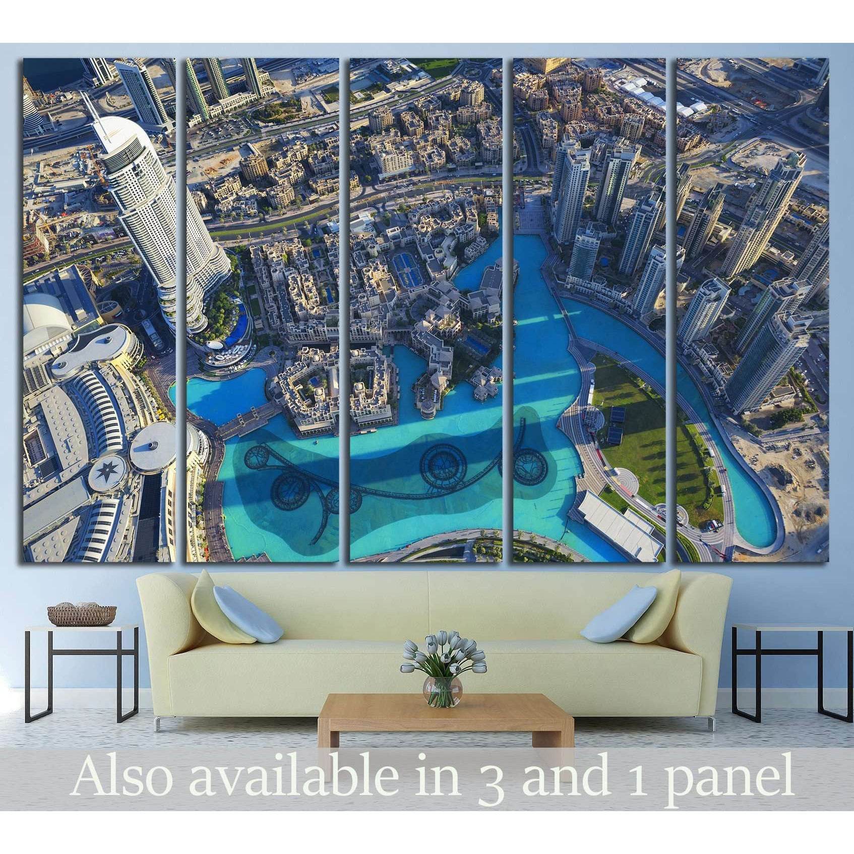 Dubai aerial canvas print with downtown skyscrapers and turquoise fountain pools above a sofa