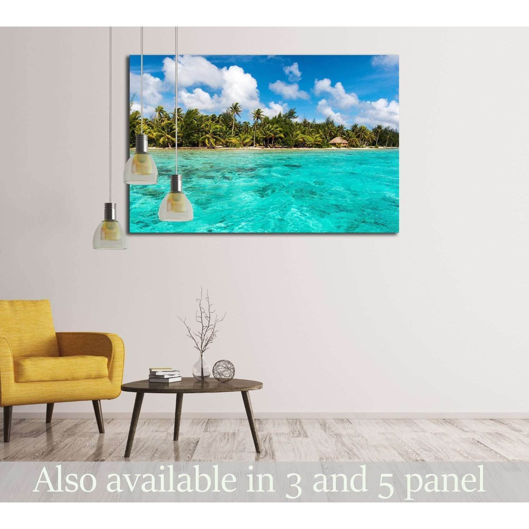 Bora Bora lagoon canvas print with turquoise water, palm-lined shore, and blue sky in a modern living room