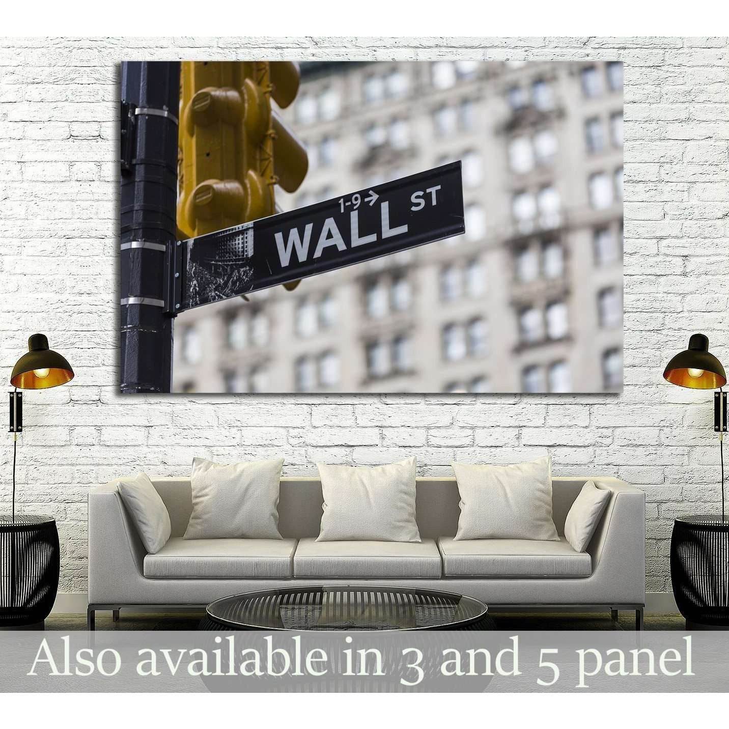 Wall Street sign canvas print with yellow NYC traffic light above sofa in a modern office lounge