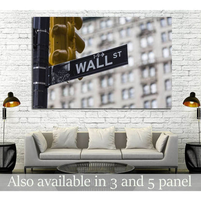 Wall Street sign canvas print with yellow NYC traffic light above sofa in a modern office lounge