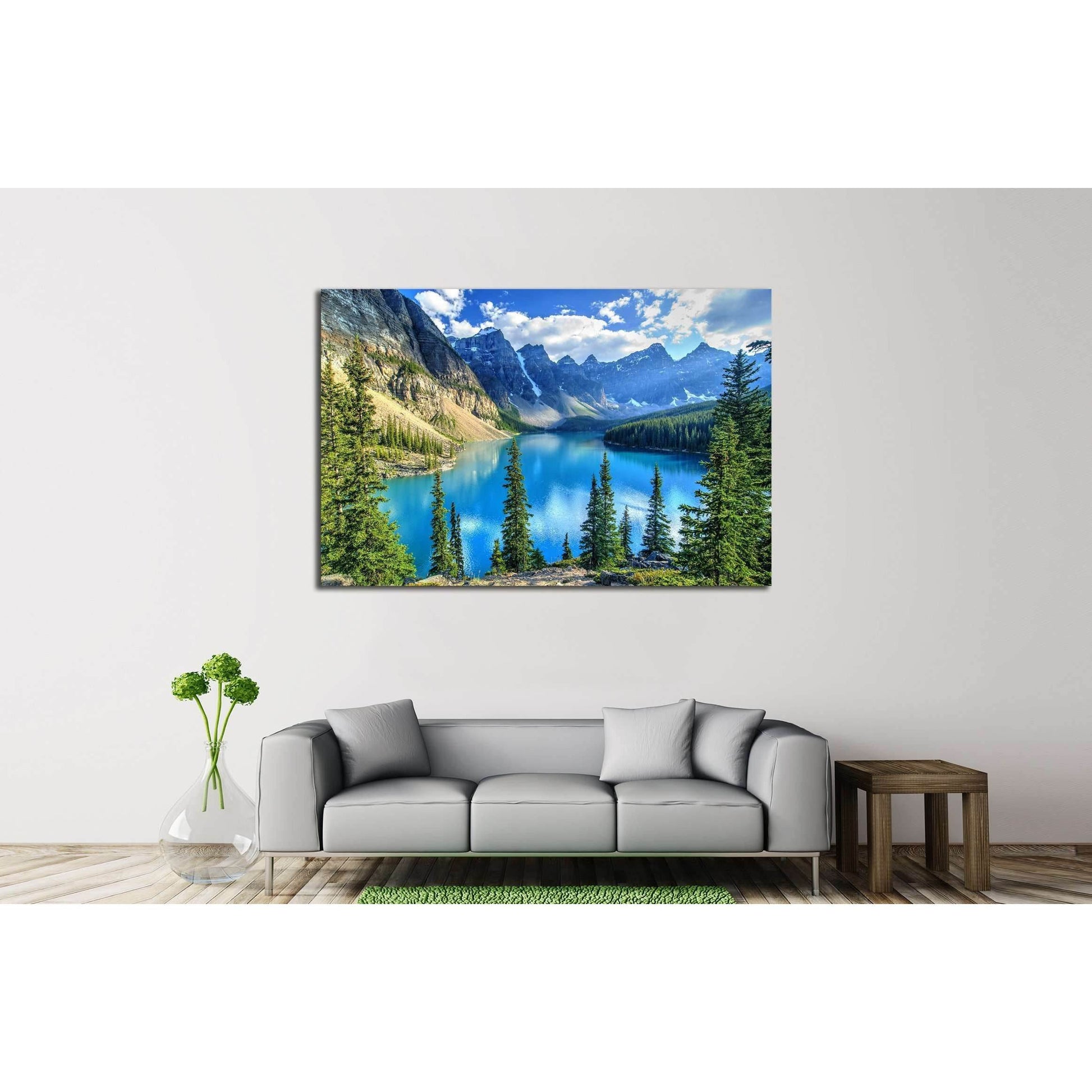 Moraine Lake and Wenkchemna Peaks Canvas Print - Majestic Landscape Wall ArtThis canvas print captures the stunning Wenkchemna Peaks reflected on the serene Moraine Lake, with its vibrant turquoise waters surrounded by verdant evergreens. The majestic mou